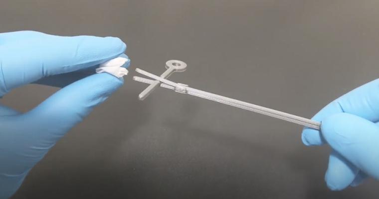 The testing swab is comprised of PLA-printed plastic and a folded and wrapped...