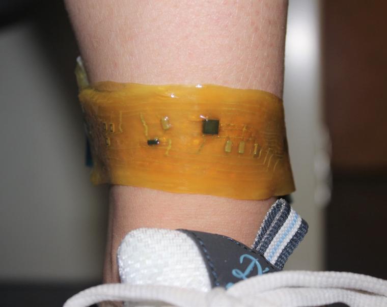 A user wears a device on the ankle.