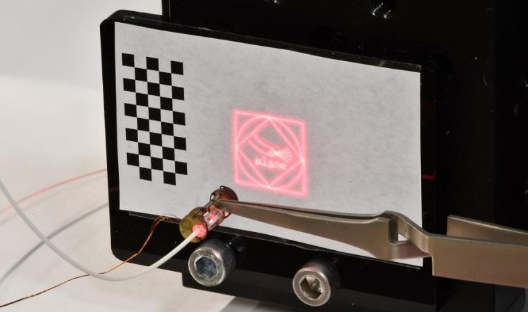 The laser steering device is able to trace complex trajectories such as an...
