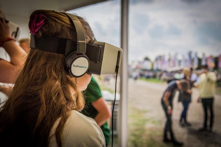 A visitor of Lowlands music festival participating in the study, in the VR...