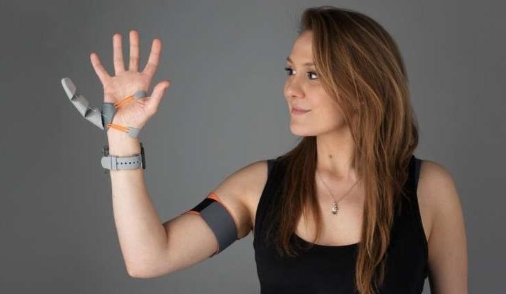 Designer Dani Clode with her Third Thumb device.