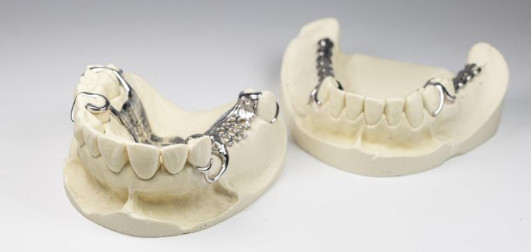 Dental prostheses like these are currently produced by hand in a laborious...