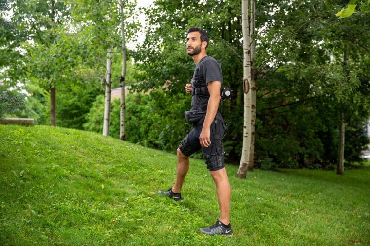 The light-weight versatile exosuit assists hip extension during uphill walking...