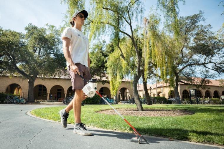 Stanford PhD candidate Michael John Raitor tests out the augmented cane,...