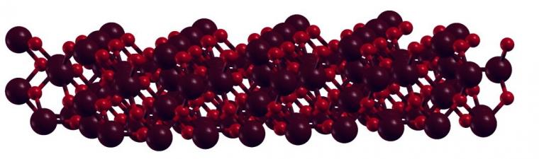 A schematic showing the lattice structure of magnetene, with the dark red...