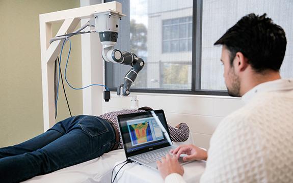 Based on an analysis of the patient by a thermal camera, a collaborative robot...