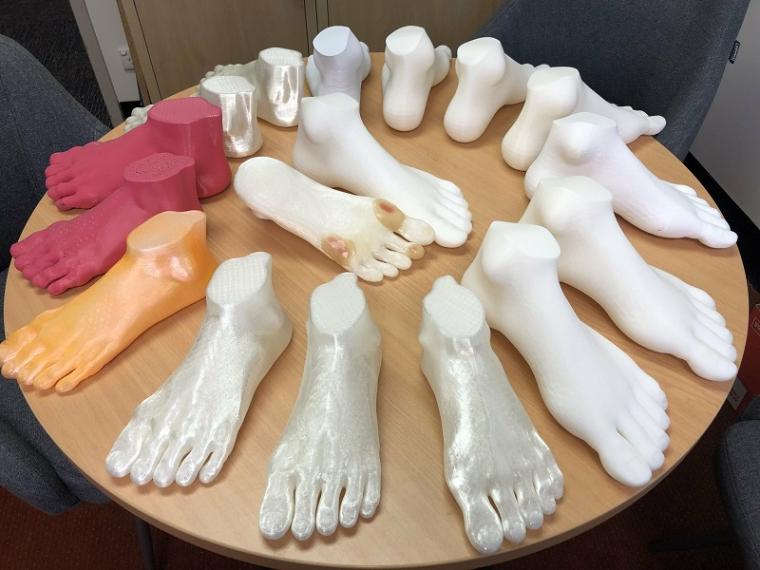 Some of these 3D-printed feet are enhanced with foot ulcers.