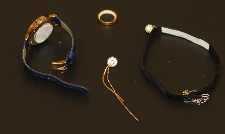 Selection of potential contraceptive jewelry, in clockwise order, a...