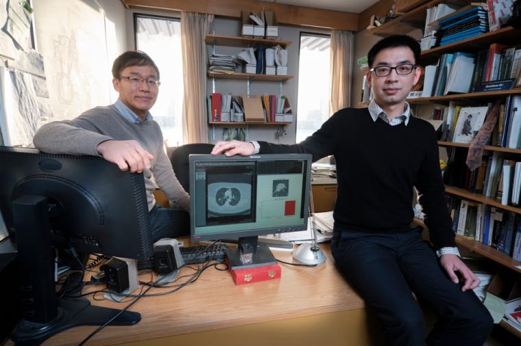 Seok-Bum Ko (left) and Yi Wang whose software “learns” to spot disease...