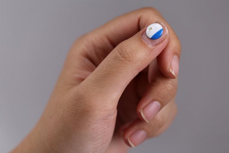 UVA sunlight skin sensor on fingernail.