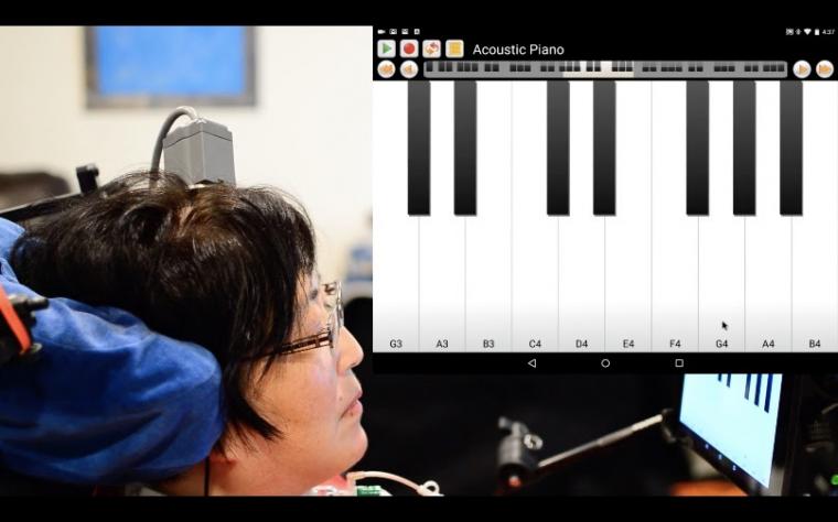 A participant in the BrainGate clinical trial plays “Ode to Joy” on a...