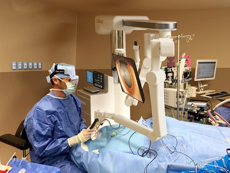 The surgeon is using the all-new ORLenz augmented reality surgery headset.
