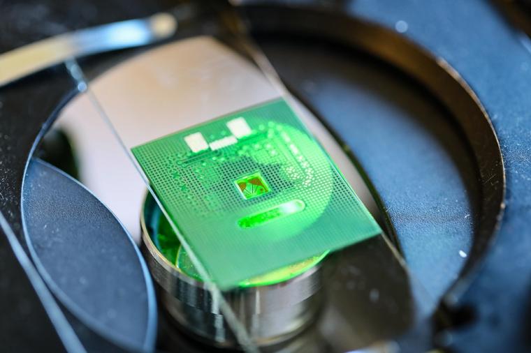 A microfluidic path brings the biofluids toward the chip.